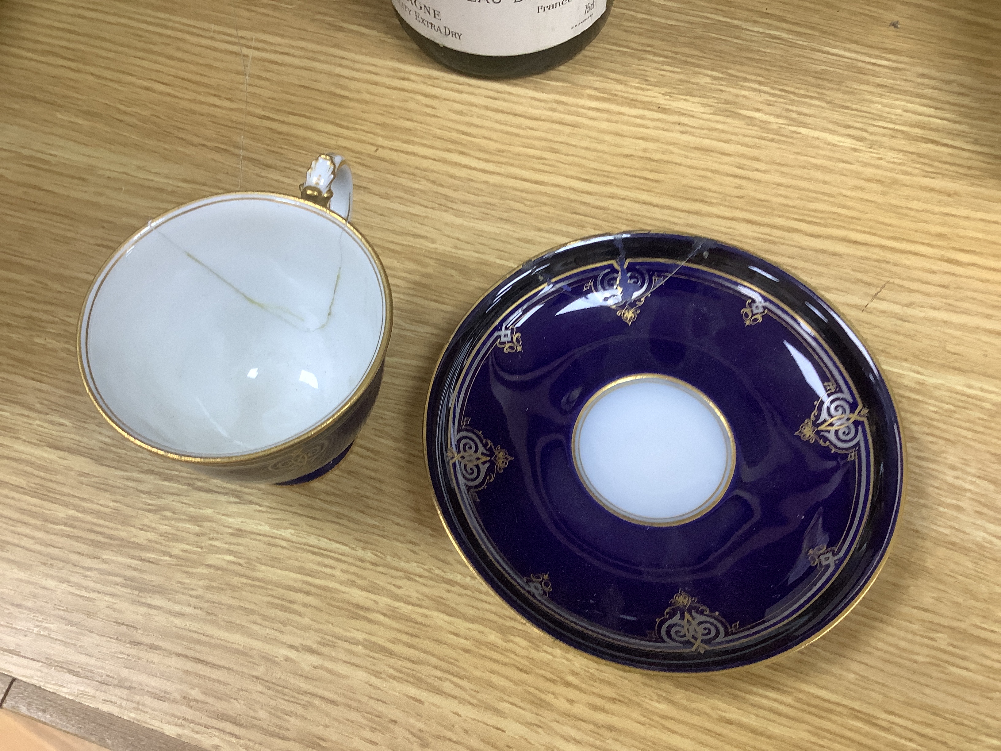 A late 19th century Meissen cabaret set comprising sugar bowl and cover, teapot and cover, creamer, two cups, a saucer and a tray (a.f.)